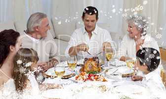 Composite image of father serving turkey to his family in a dinn
