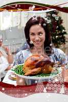 Woman showing to the camera christmas turkey