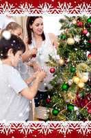 Happy children and parents decorating a christmas tree