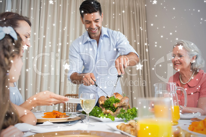 Composite image of extended family at dining table