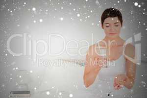 Composite image of charming woman taking pills