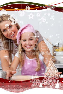 Mother and daughter baking christmas cookies in the kitchen