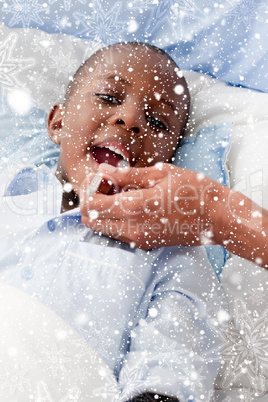 Composite image of small boy sick in bed
