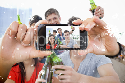 Hand holding smartphone showing photo