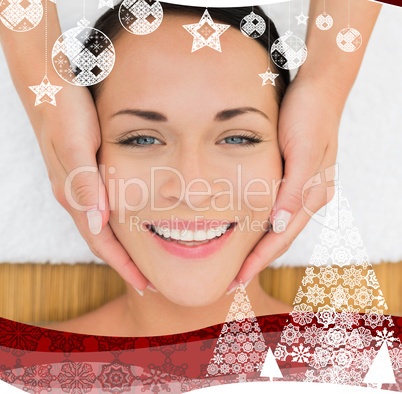 Peaceful brunette enjoying a facial massage