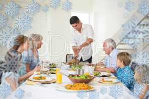 Composite image of father serving meal to family