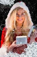 Composite image of pretty blonde in santa outfit opening gift