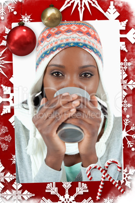 Composite image of young woman enjoying tea in the cold