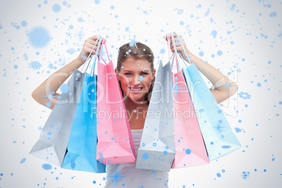 Joyful woman holding shopping bags