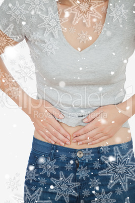 Composite image of woman with abdominal pain