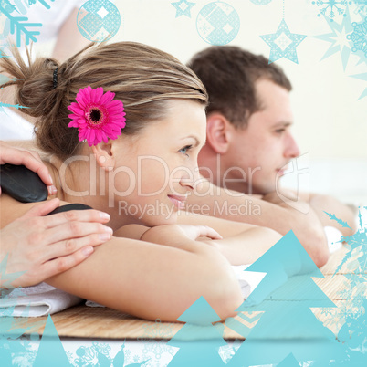 Cheerful young couple enjoying a spa treatment