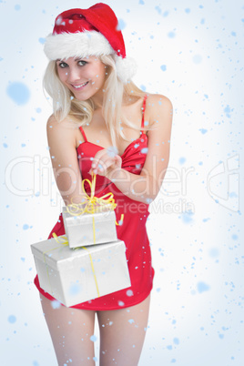Composite image of woman opening christmas present