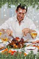 Composite image of attractive man eating turkey in christmas din