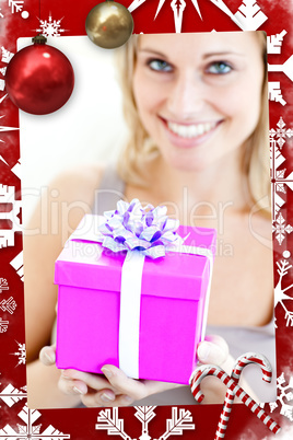 Charming woman holding a present in front of her