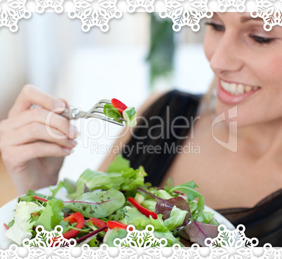 Close up of a smiling woman eating a salad