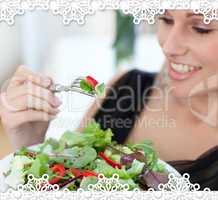 Close up of a smiling woman eating a salad