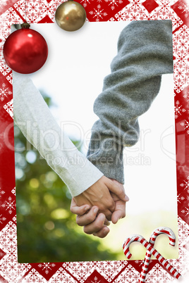 Cute couple holding hands in the park