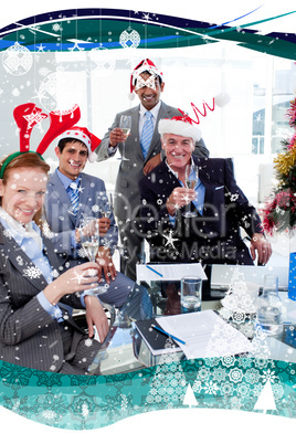 Manager and his team toasting with champagne at a christmas part