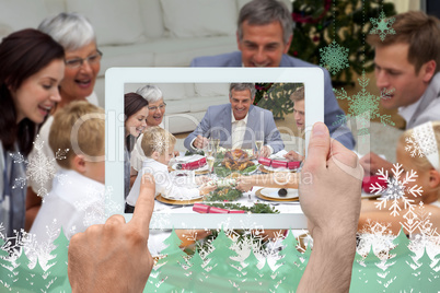 Composite image of hand holding tablet pc