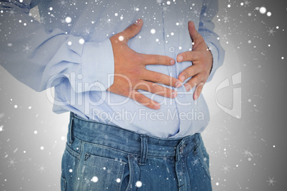 Closeup mid section of a casual man with stomach pain