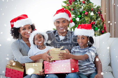 Smiling family sharing christmas presents