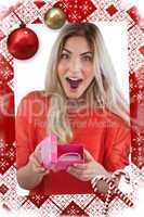 Composite image of surprised woman discovering necklace on a box