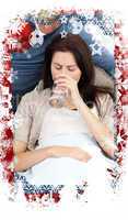 Composite image of sick woman drinking water lying on the sofa