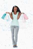 Composite image of woman happy about her shopping on white backg