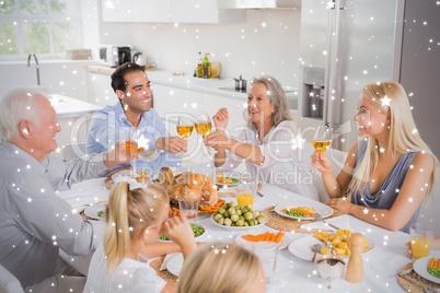 Composite image of smiling adults raising their glasses