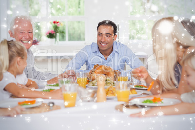 Composite image of happy family at thanksgiving