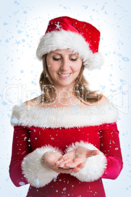 Pretty woman in santa costume presenting your product