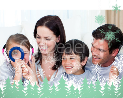 Composite image of happy family playing with a magnifying glass