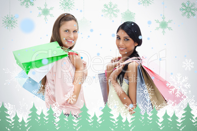 Smiling women with a lot of shopping bags