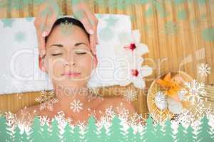 Smiling brunette enjoying a head massage