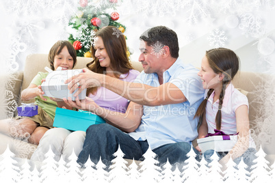 Composite image of family exchanging christmas presents