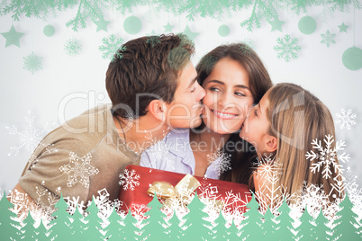 Composite image of father and his daughter offering a red gift