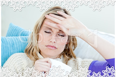 Sick woman with headache lying on the sofa in the livingroom