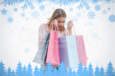 A woman is carrying shopping bags