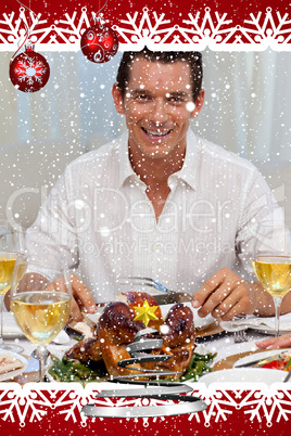 Smiling man eating turkey in christmas dinner