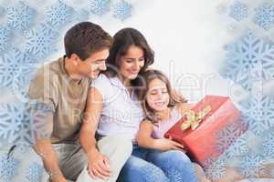 Composite image of parents offering a gift
