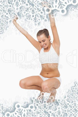 Composite image of happy attractive woman crouching on a scales