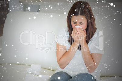 Composite image of sick woman sneezing