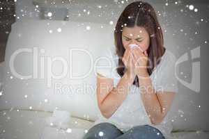 Composite image of sick woman sneezing