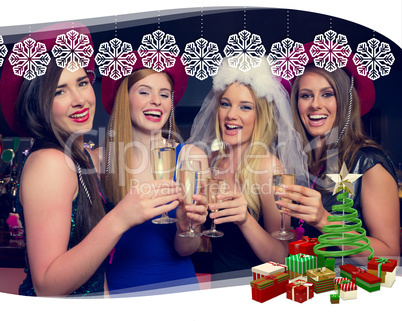 Laughing friends clinking champagne glasses at a hen night