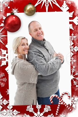 Composite image of happy mature couple in winter clothes