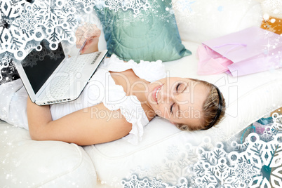 Composite image of pretty blond woman shopping online at home