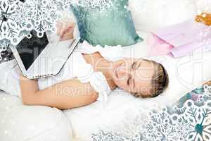 Composite image of pretty blond woman shopping online at home