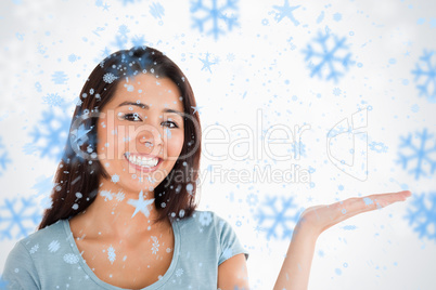 Portrait of a gorgeous woman showing a copy space while standing