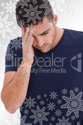 Sad man holding his forehead with his hand
