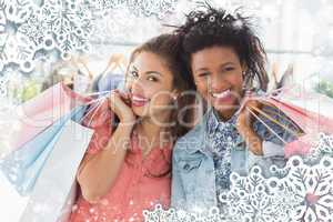 Young women with shopping bags in clothes store